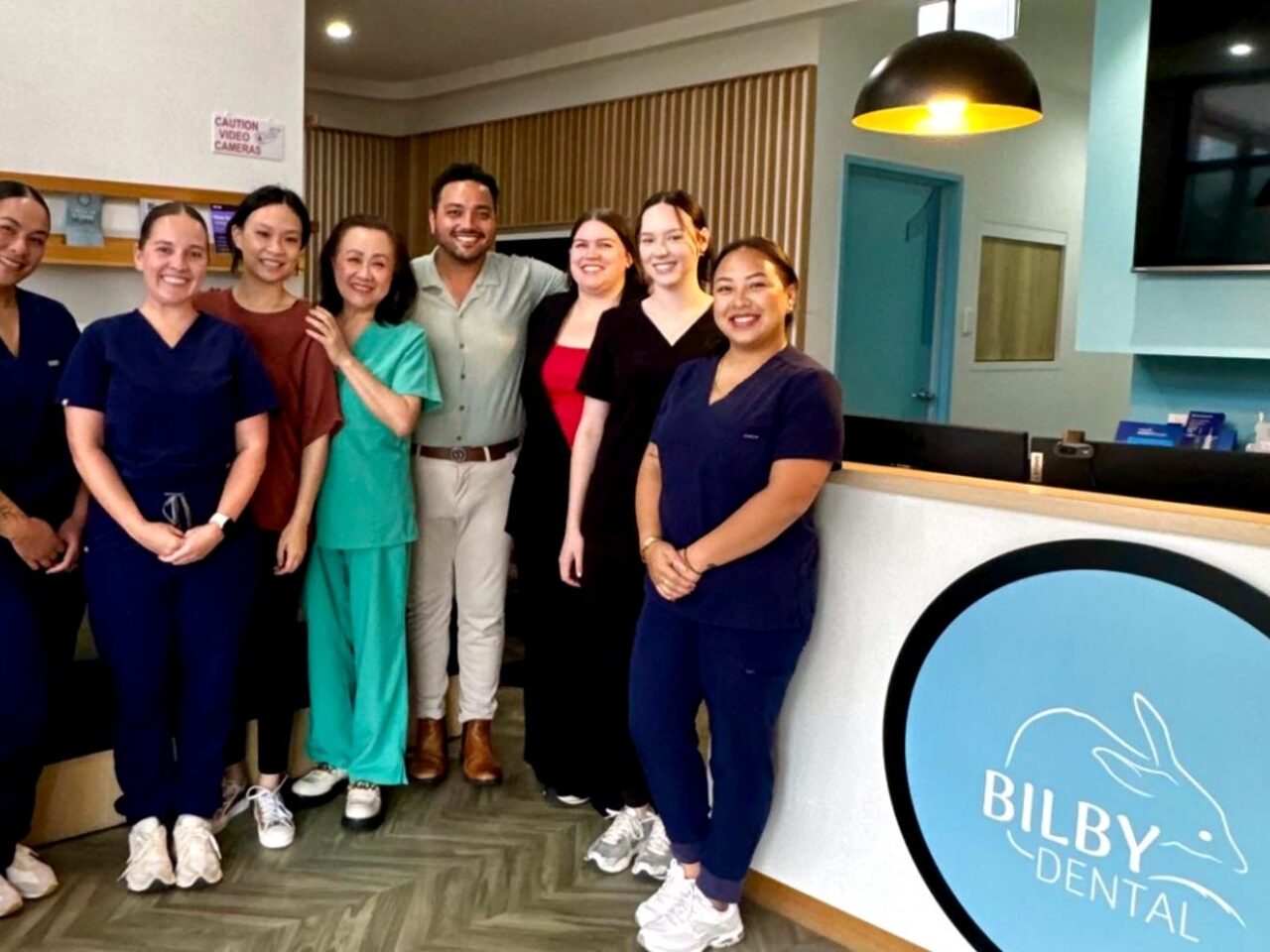 The Bilby Dental clinicians and dental assistants at the practice reception in Yarrabilba
